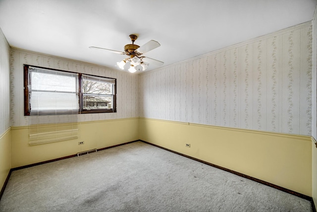 16157 Ozark Ave, Tinley Park, IL 60477 - empty room featuring a ceiling fan, wallpapered walls, visible vents, and carpet