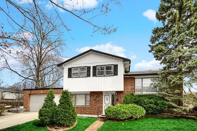 16157 Ozark Ave, Tinley Park, IL 60477 - tri-level home with brick siding, an attached garage, a front lawn, and concrete driveway