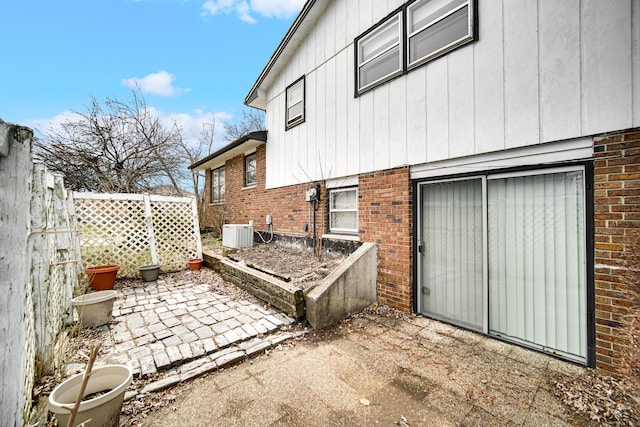 16157 Ozark Ave, Tinley Park, IL 60477 - view of side of property with central air condition unit, brick siding, fence, and a patio area