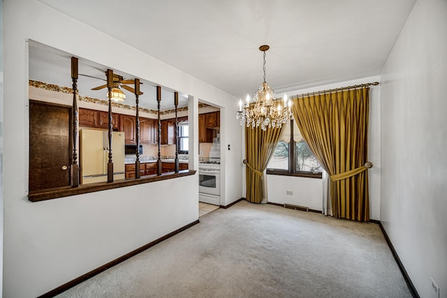 16157 Ozark Ave, Tinley Park, IL 60477 - unfurnished dining area featuring ceiling fan with notable chandelier, baseboards, and light colored carpet