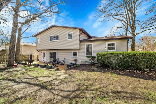 back of house featuring a patio area and fence