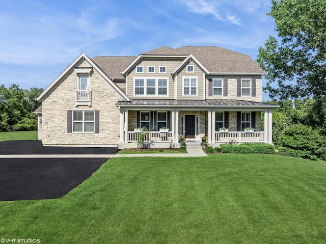 32 E Peter Ln, Hawthorn Woods, IL 60047 - view of front of house with a standing seam roof, a porch, stone siding, and a front yard