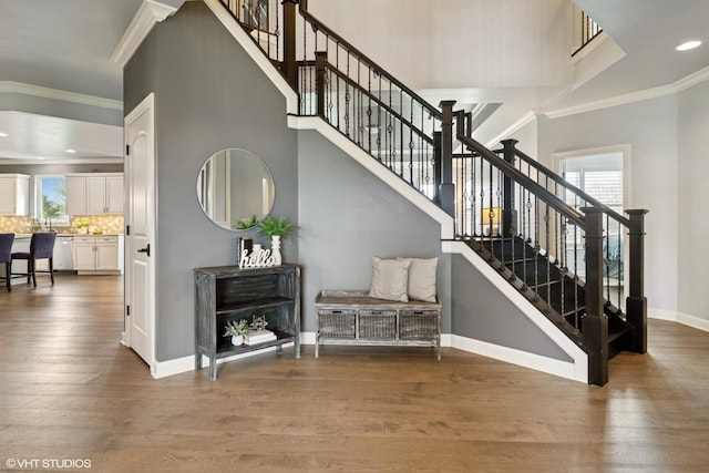 32 E Peter Ln, Hawthorn Woods, IL 60047 - staircase with plenty of natural light, crown molding, wood finished floors, recessed lighting, and a towering ceiling