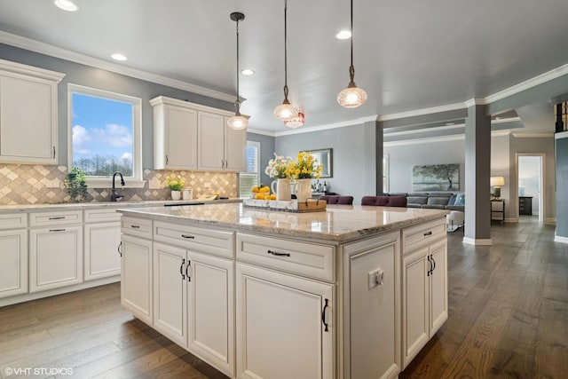32 E Peter Ln, Hawthorn Woods, IL 60047 - kitchen featuring a center island, tasteful backsplash, crown molding, dark wood-style floors, and recessed lighting