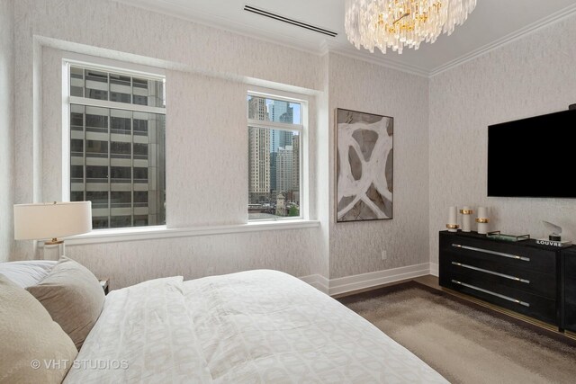 435 N Michigan Ave Unit 401, Chicago, IL 60611 - bedroom featuring an AC wall unit, an inviting chandelier, crown molding, and baseboards