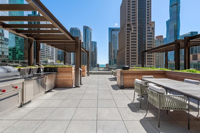 435 N Michigan Ave Unit 401, Chicago, IL 60611 - view of patio / terrace featuring a city view, a pergola, an outdoor kitchen, and grilling area