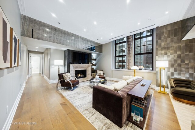 435 N Michigan Ave Unit 401, Chicago, IL 60611 - living area featuring recessed lighting, wood finished floors, a premium fireplace, tile walls, and baseboards