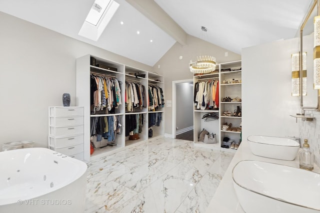 7267 Southwick Dr, Frankfort, IL 60423 - spacious closet featuring marble finish floor, a sink, a notable chandelier, and vaulted ceiling with skylight