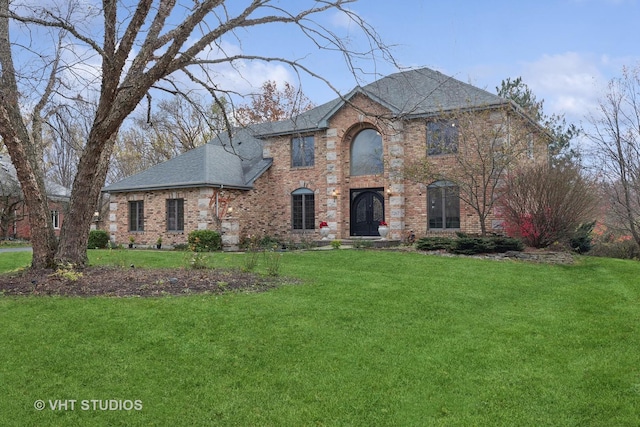 7267 Southwick Dr, Frankfort, IL 60423 - french provincial home featuring a front lawn, brick siding, and roof with shingles