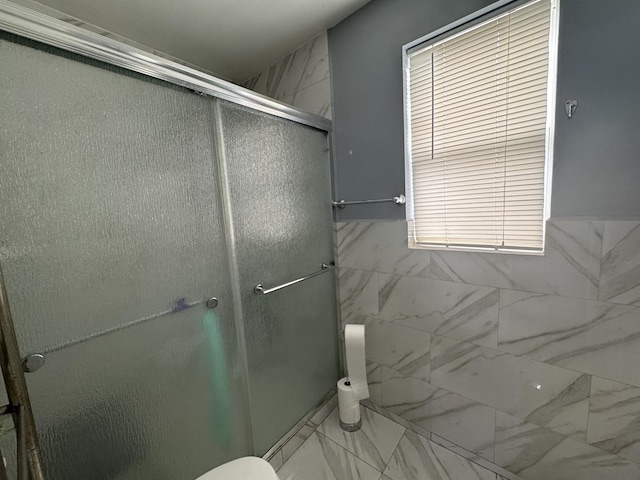 554 Spring St, Aurora, IL 60505 - bathroom featuring a shower stall, marble finish floor, and toilet