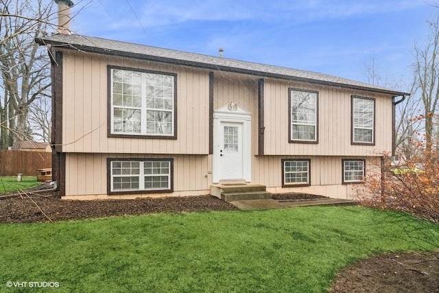 23726 N Overhill Dr, Lake Zurich, IL 60047 - raised ranch with fence, a front lawn, and a chimney