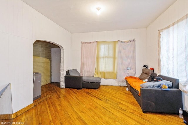 1733 N Keating Ave, Chicago, IL 60639 - living area with arched walkways and light wood finished floors