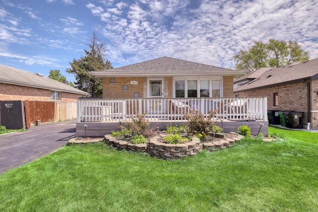 back of house with a wooden deck and brick siding