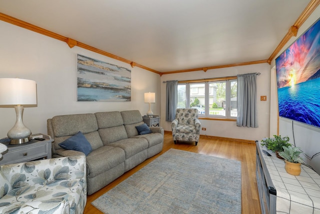 living area featuring crown molding and wood finished floors
