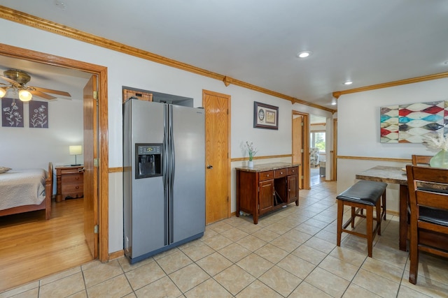 kitchen with stainless steel fridge, crown molding, light tile patterned floors, a ceiling fan, and recessed lighting