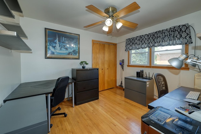 office area featuring light wood-style flooring and a ceiling fan