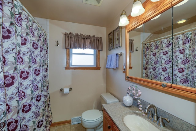 bathroom featuring tile patterned flooring, toilet, vanity, curtained shower, and baseboards