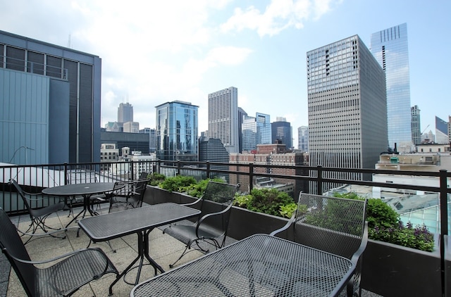 balcony featuring a skyline view