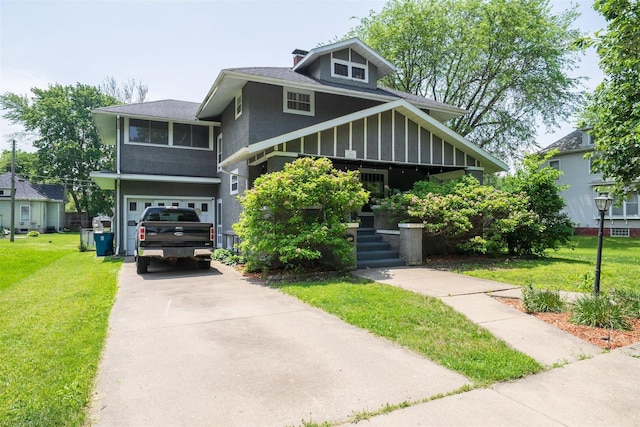 316 E Pierce St, Pontiac, IL 61764 - view of front facade featuring a front yard, concrete driveway, an attached garage, and a shingled roof