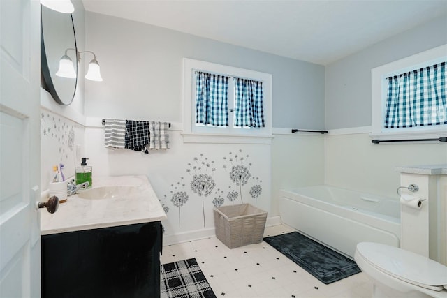 316 E Pierce St, Pontiac, IL 61764 - bathroom featuring a bath, vanity, tile patterned floors, and toilet