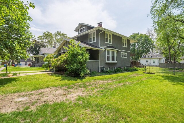 316 E Pierce St, Pontiac, IL 61764 - rear view of property featuring a chimney and stucco siding