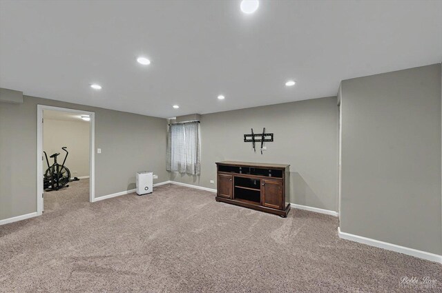 basement with carpet floors, recessed lighting, and baseboards