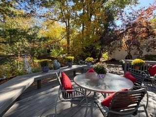 wooden deck with outdoor dining area