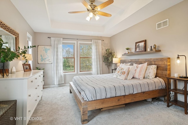 23114 W N Lakewood Ln, Lake Zurich, IL 60047 - bedroom featuring light colored carpet, a raised ceiling, baseboards, and a ceiling fan
