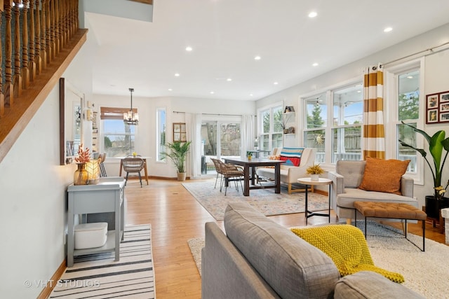 23114 W N Lakewood Ln, Lake Zurich, IL 60047 - living room featuring recessed lighting, baseboards, light wood-style flooring, a chandelier, and stairs