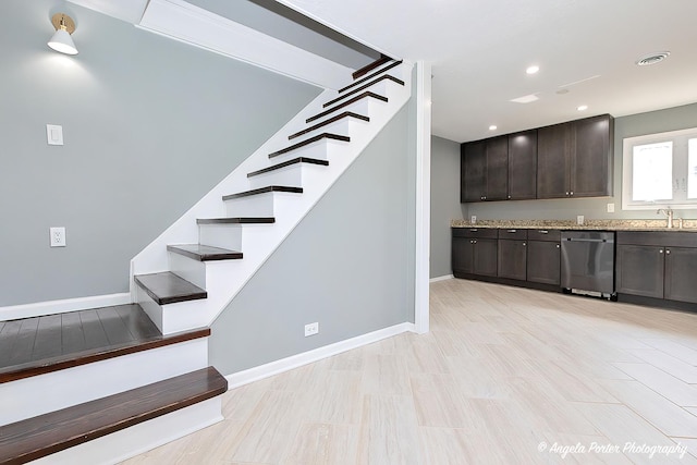 stairway with visible vents, recessed lighting, baseboards, and wood finished floors