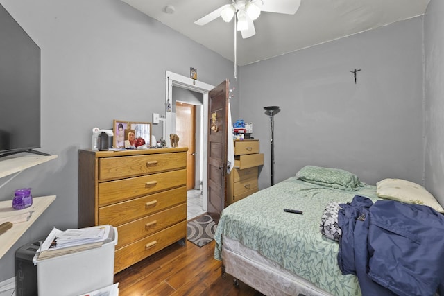 bedroom with a ceiling fan and wood finished floors