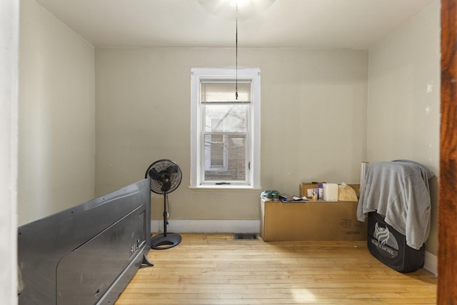 dining space featuring visible vents, baseboards, and wood-type flooring