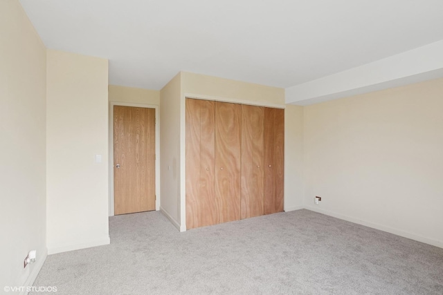 898 Wellington Ave Unit 310, Elk Grove Village, IL 60007 - unfurnished bedroom featuring carpet, a closet, and baseboards