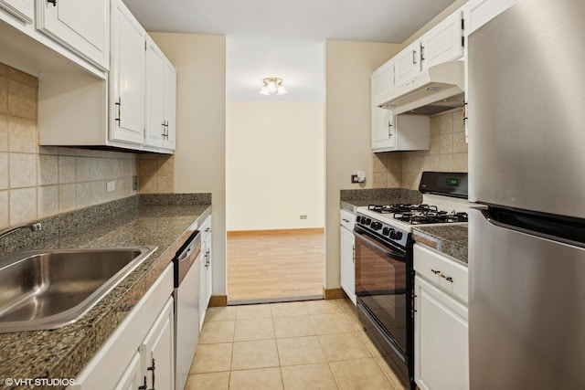 898 Wellington Ave Unit 310, Elk Grove Village, IL 60007 - kitchen with stainless steel appliances, under cabinet range hood, a sink, dark countertops, and white cabinetry