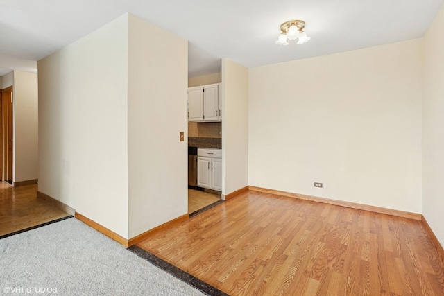 898 Wellington Ave Unit 310, Elk Grove Village, IL 60007 - unfurnished room featuring baseboards and light wood-style floors
