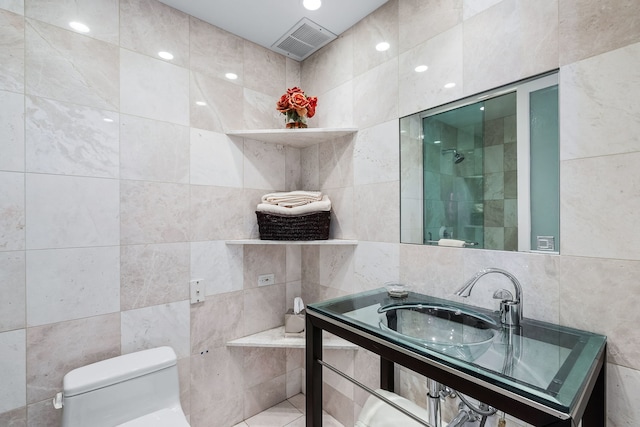 180 E Pearson St Unit 4503, Chicago, IL 60611 - full bath featuring a sink, tile walls, toilet, visible vents, and tiled shower