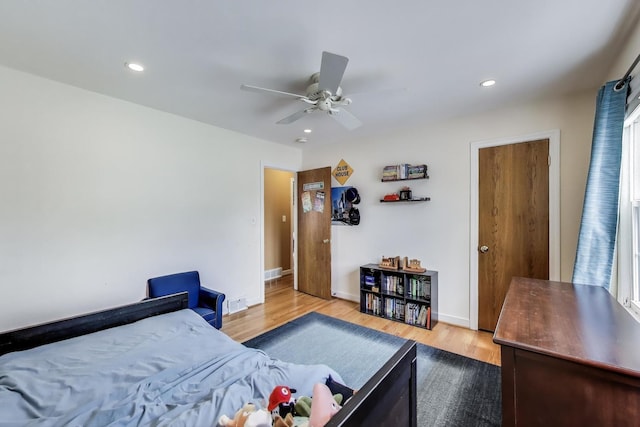 bedroom featuring light wood-style flooring, baseboards, recessed lighting, and a ceiling fan
