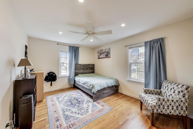 bedroom with light wood-type flooring, a ceiling fan, baseboards, and recessed lighting