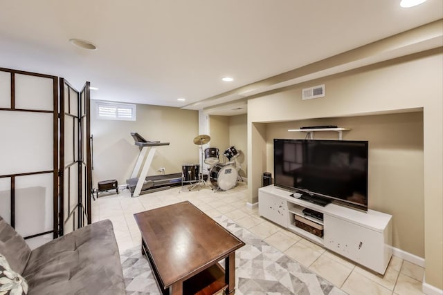 living area with recessed lighting, visible vents, and light tile patterned floors