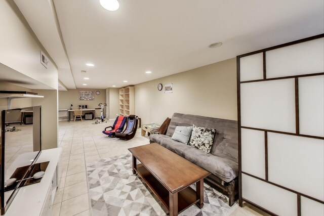 living area with visible vents, recessed lighting, and light tile patterned floors