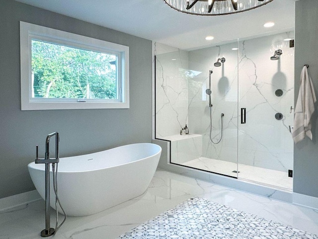 bathroom featuring a marble finish shower, a freestanding bath, baseboards, recessed lighting, and marble finish floor