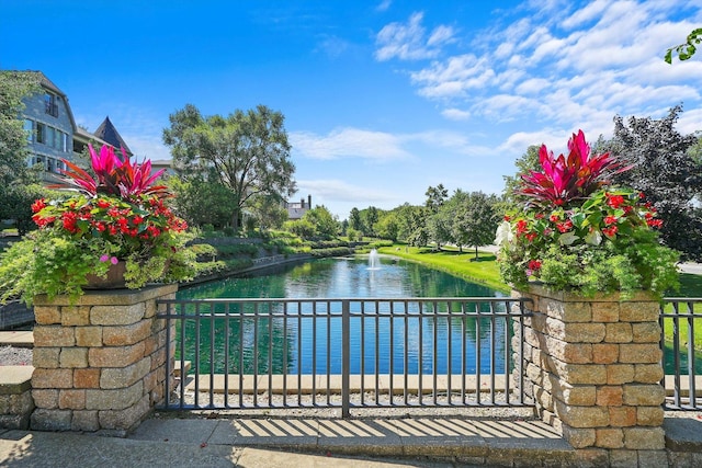 view of gate with a water view