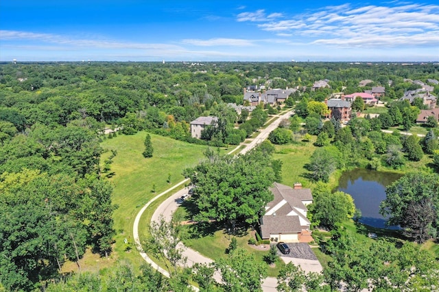 birds eye view of property with a wooded view