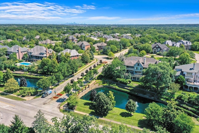 bird's eye view featuring a water view and a residential view