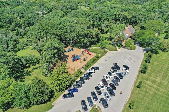 drone / aerial view with a wooded view
