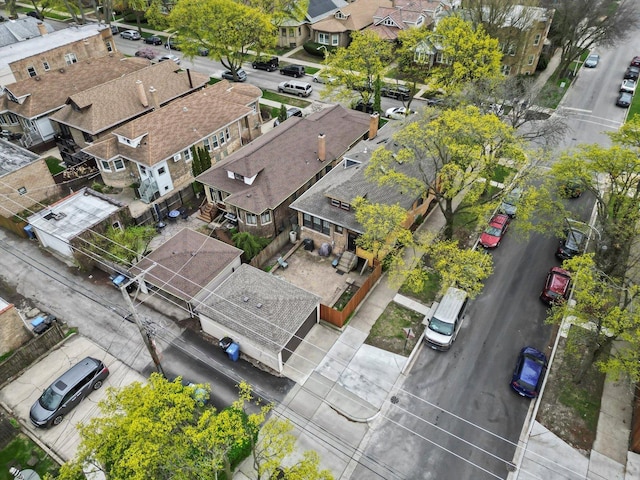 birds eye view of property with a residential view