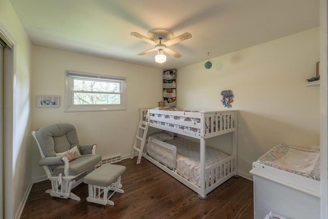 bedroom with wood finished floors, ceiling fan, and baseboards