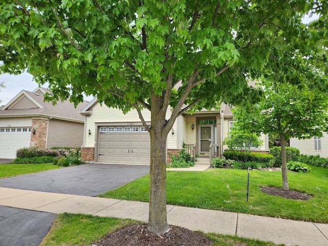 1187 Barkston Ct, Aurora, IL 60502 - view of property hidden behind natural elements with driveway, brick siding, a front lawn, and an attached garage