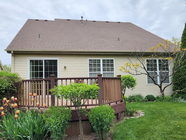 1187 Barkston Ct, Aurora, IL 60502 - rear view of house featuring a wooden deck, a lawn, and roof with shingles