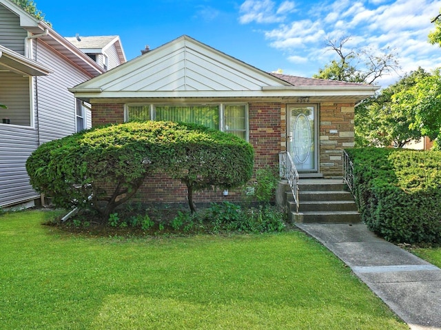 2758 N Newcastle Ave, Chicago, IL 60707 - view of front of house featuring a front lawn and brick siding